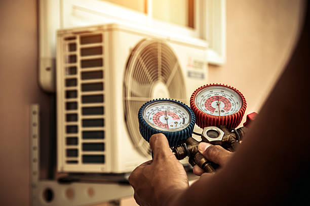 Professional Air Conditioning Service technician working in Batavia, NY
